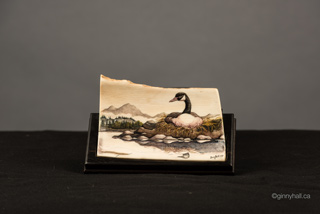A scrimshaw peice by Ginny Hall 						 		depicting a goose.