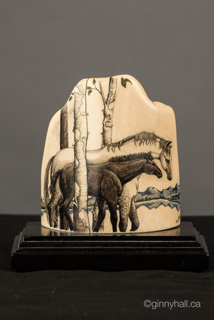 A scrimshaw peice by Ginny Hall 						 		depicting a horses.